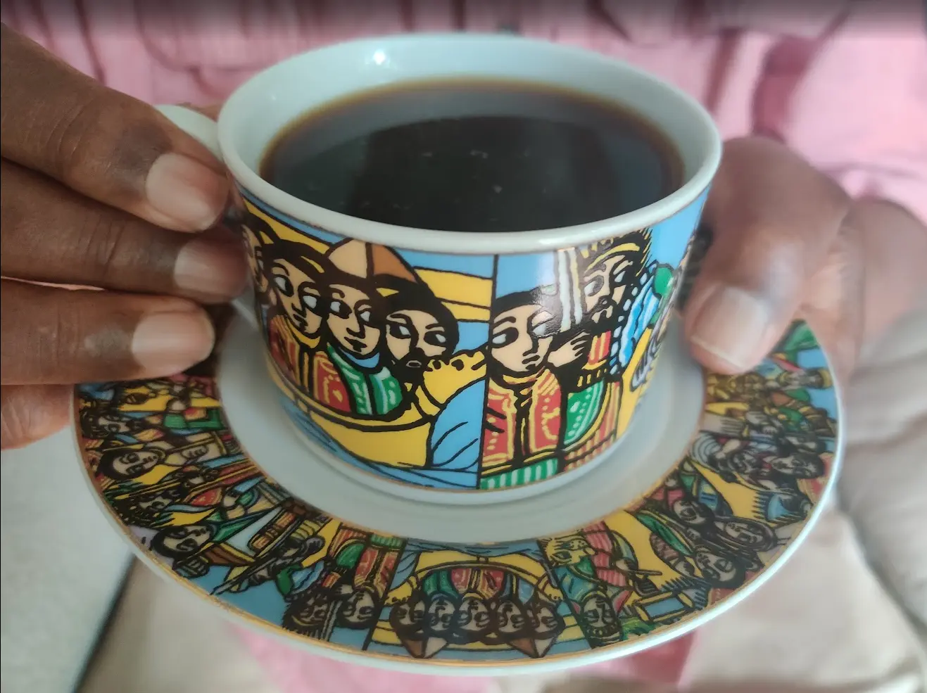 Ethiopian coffee served in an illustrated cup and saucer